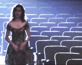 Cleavage and with her legs in the air in Walk Hard!