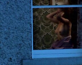 Bare Boobs through a window from Turning Green!